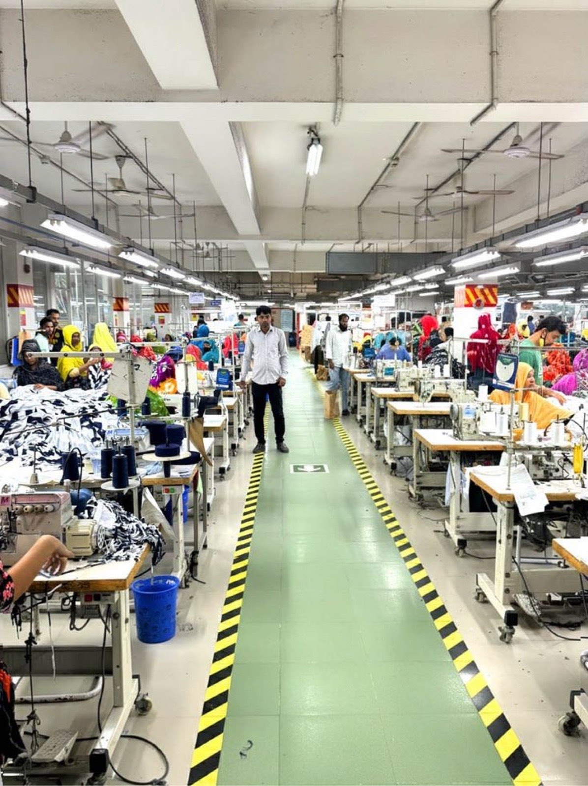An aisle of the Victorious Industries sewing floor