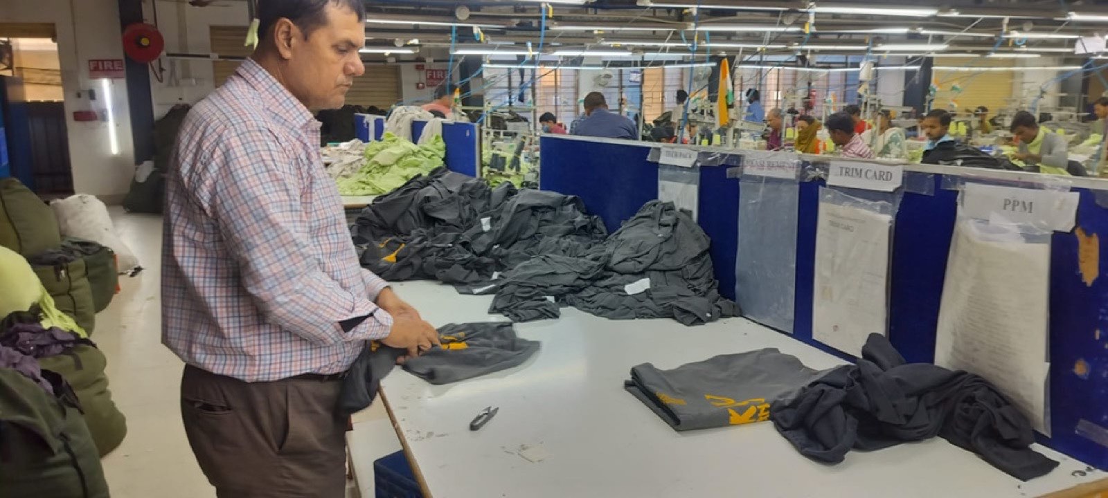 Folding and packing garments at Victorious Industries