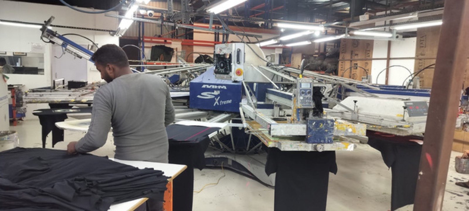 MHM automatic screen-printing carousel on the Victorious Industries print floor